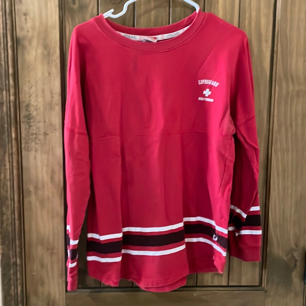 Long sleeve shirt that says lifeguard schlitterbahn.